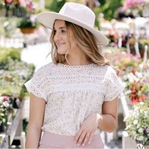 The Main Street Exchange White Floral and Lace top with buttons on back by Mine